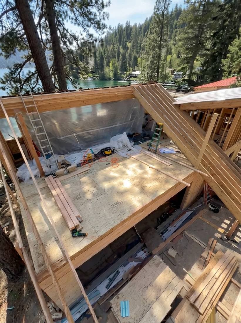 Antova crew framing a lakeside home